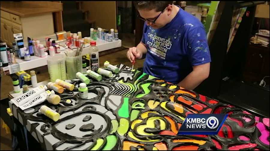 An Overland Park artist who started making headlines at a very young age has been commissioned to do a masterpiece for Coca-Cola.