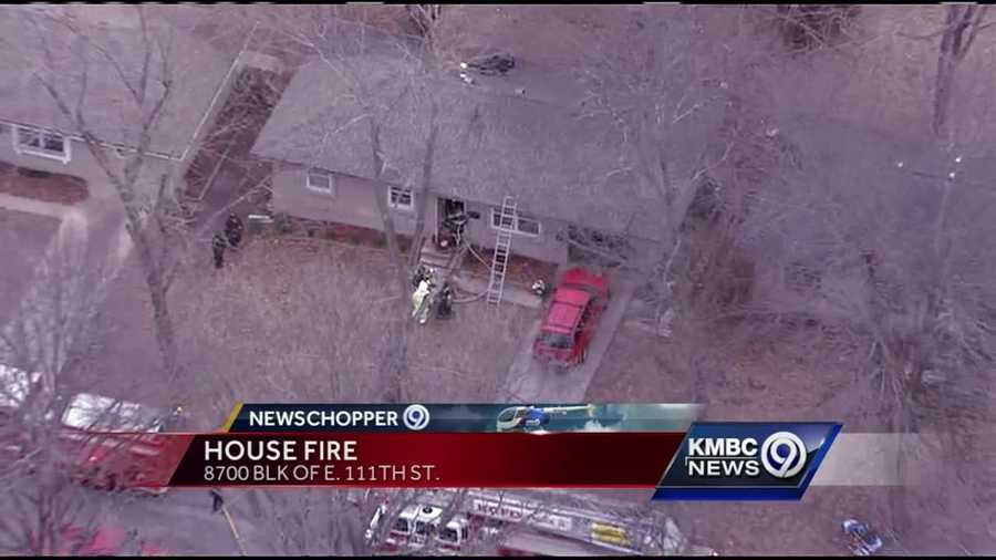 Firefighters pulled one person out of a burning home in southeast Kansas City Tuesday afternoon.