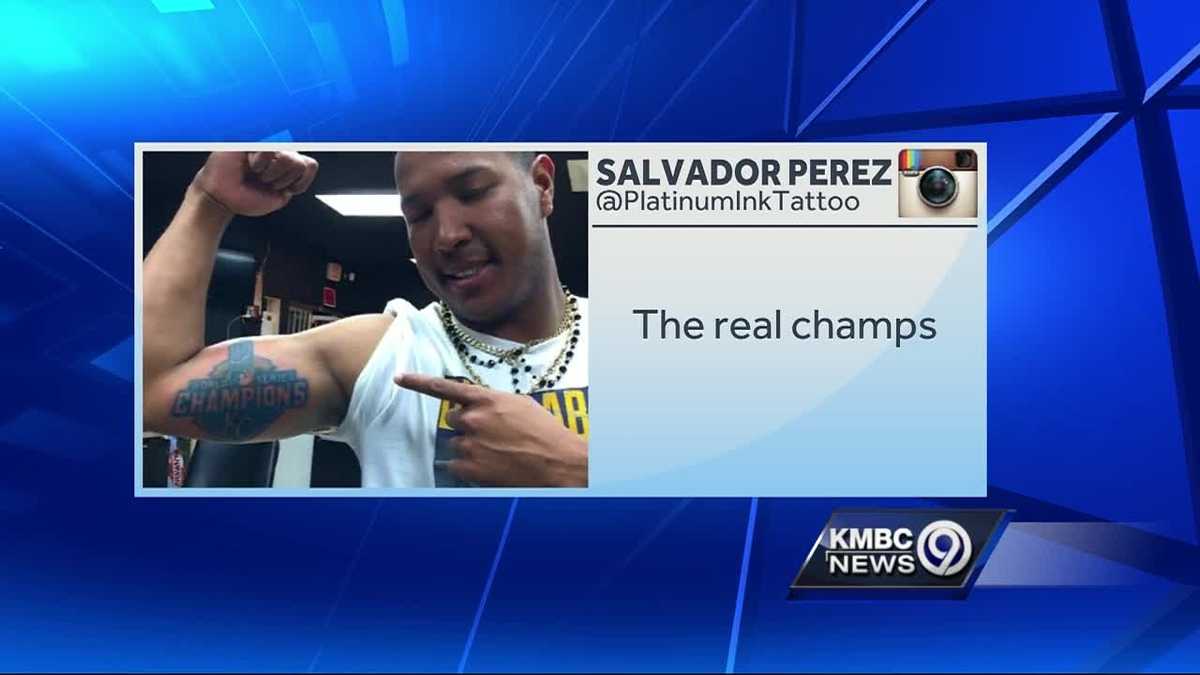Salvador Perez shows off his new World Series ink