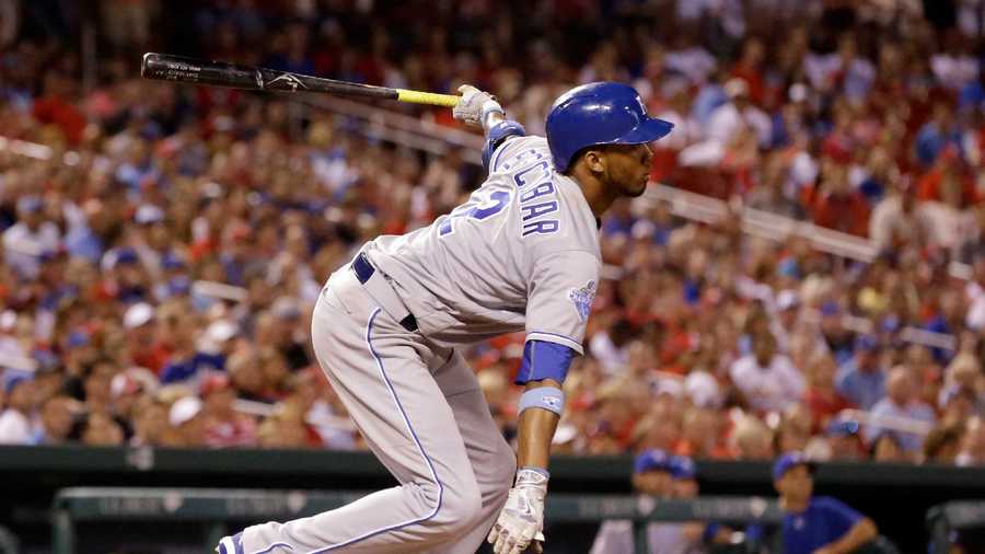 Kansas City Royals' Alcides Escobar follows through on a sacrifice fly to score Christian Colon during the eighth inning of a baseball game against the St. Louis Cardinals Wednesday, June 29, 2016, in St. Louis. (AP Photo/Jeff Roberson)