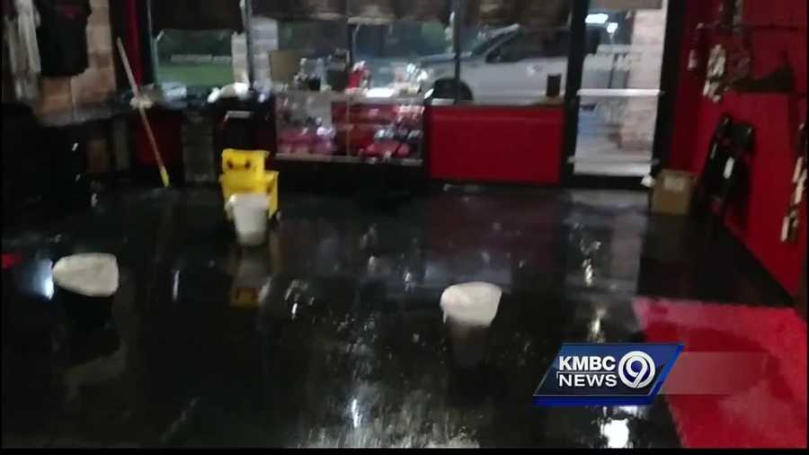 Cellphone cameras caught video of water pouring into the 9 Rounds Gym at Newmark Center after storms damaged the building's roof.
