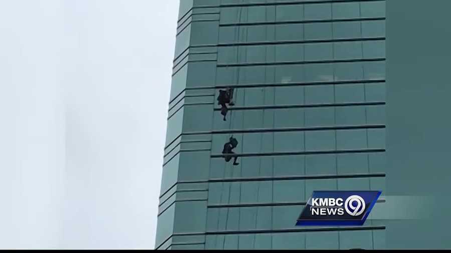 A Kansas City window washer is back on the ground after hanging from the side of a downtown building, tangled in his ropes.
