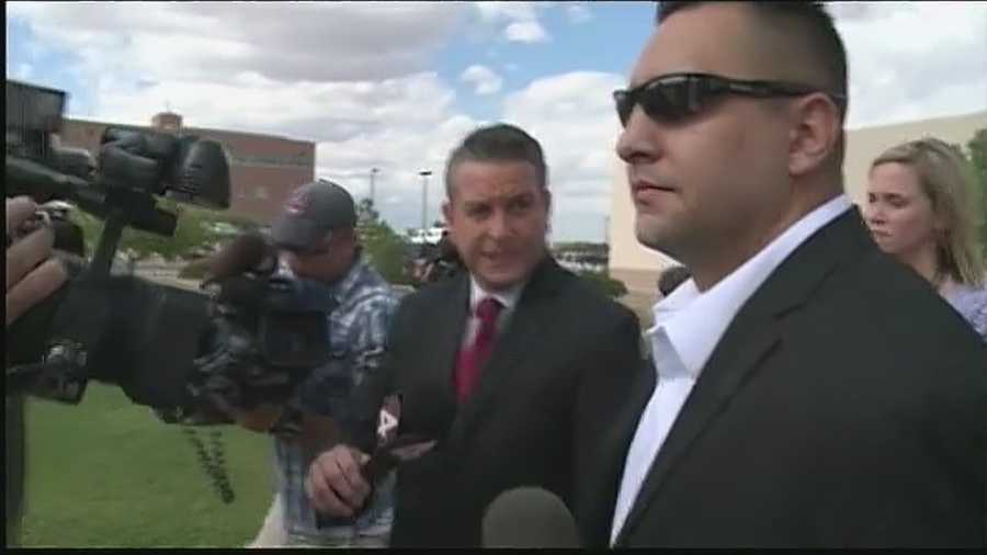 Former APD officer briskly exits courthouse