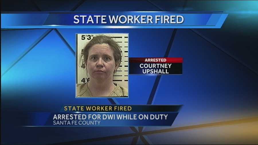Santa Fe County sheriff's deputies say they found 36-year-old Courtney Upshall from Albuquerque drunk and passed out inside her state vehicle while on duty Wednesday.