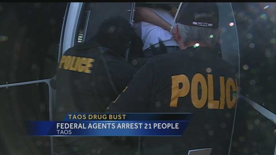 Twenty-one people were arrested Thursday during a multiagency drug bust in Taos.
