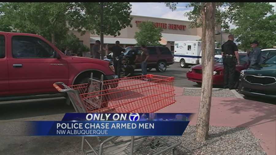 Albuquerque police chased a pair of men armed with guns through crowded stores Friday.