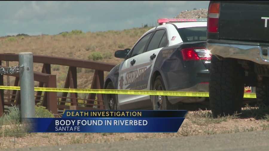 Officials in Santa Fe are trying to figure out how a man died after finding his naked body in a river bed Tuesday morning.