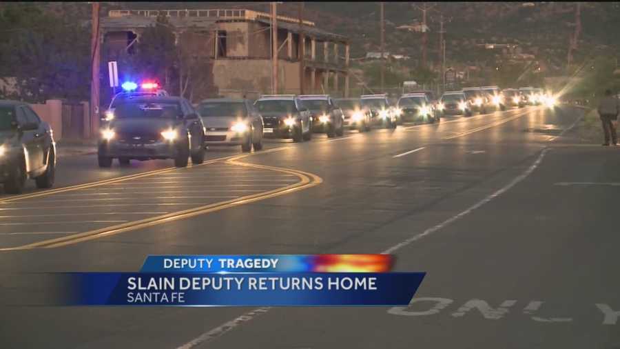 The body of 29-year-old Santa Fe Sheriff’s Deputy Jeremy Martin returned to Santa Fe Wednesday in a procession that his brothers in blue called a hero’s homecoming.