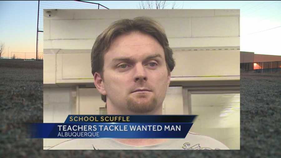 Two Albuquerque teachers stopped and tackled a man who was wanted by federal authorities.