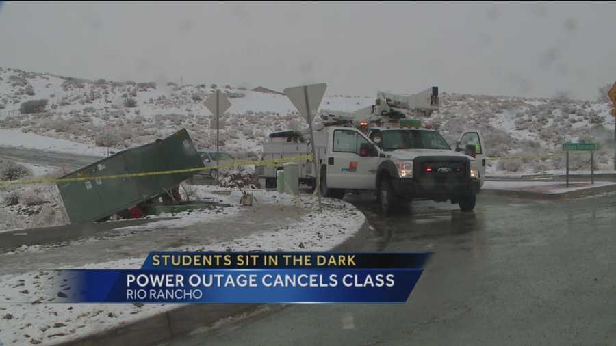 Students at Rio Rancho High School were dismissed from class early Wednesday morning after a car slid off the road near the school and knocked out the power.