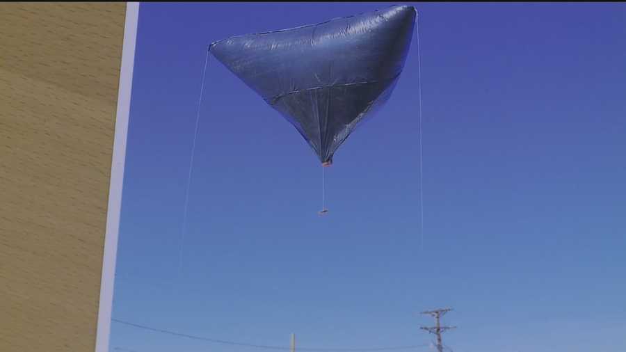 A black, diamond-shaped object drifted across the sky Sunday in Albuquerque.