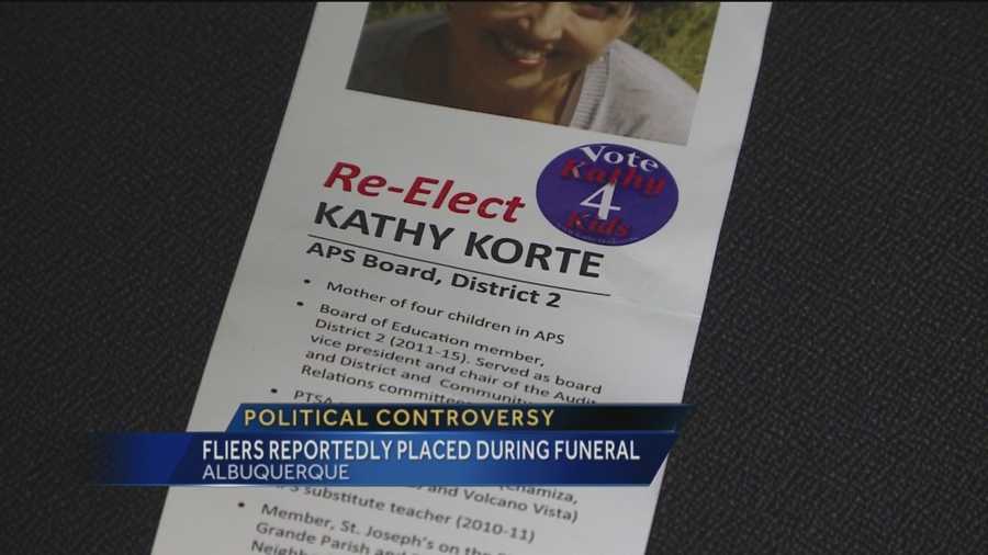 Some who attended a recent memorial service claim a candidate for the Albuquerque Public Schools board put fliers on cars nearby.