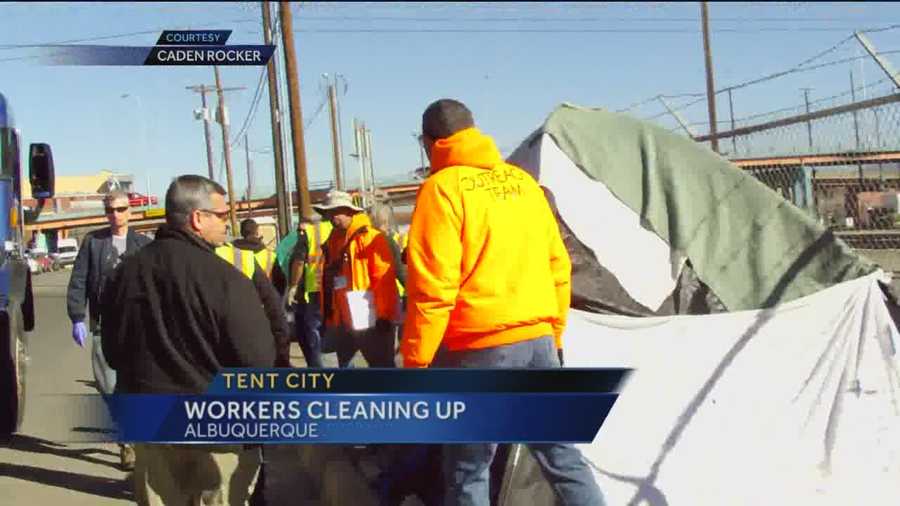 Clean up crews started tearing down unoccupied tents at a homeless camp near downtown Albuquerque on Friday.