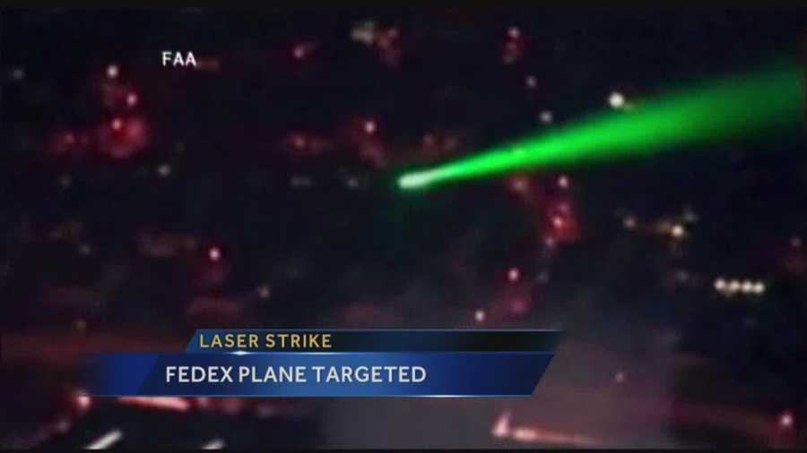 Pilots in a FedEx cargo plane were injured when someone shined a laser at the cockpit during landing at the Albuquerque Sunport.