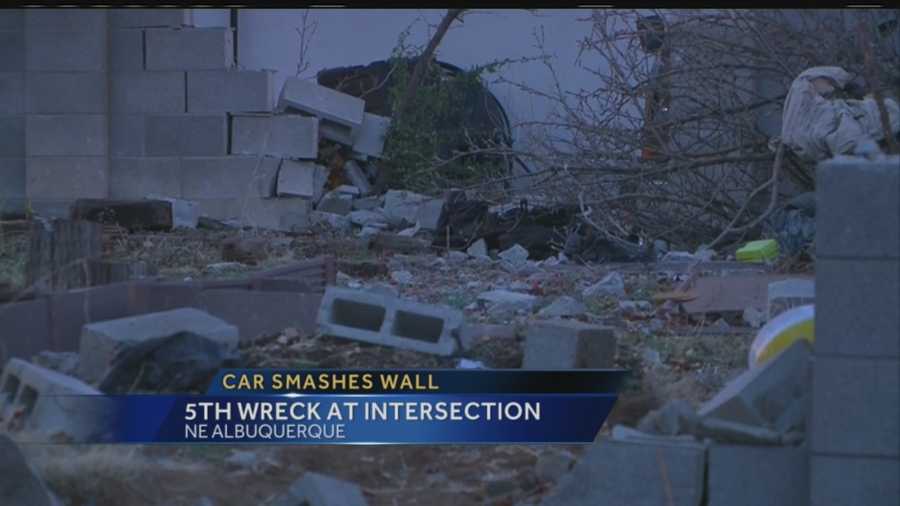 A car slammed through a wall and into the backyard of a house in northeast Albuquerque early Thursday morning.