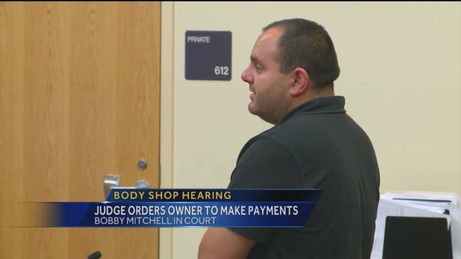 A judge has ordered a body shop owner to start paying up for shoddy work.