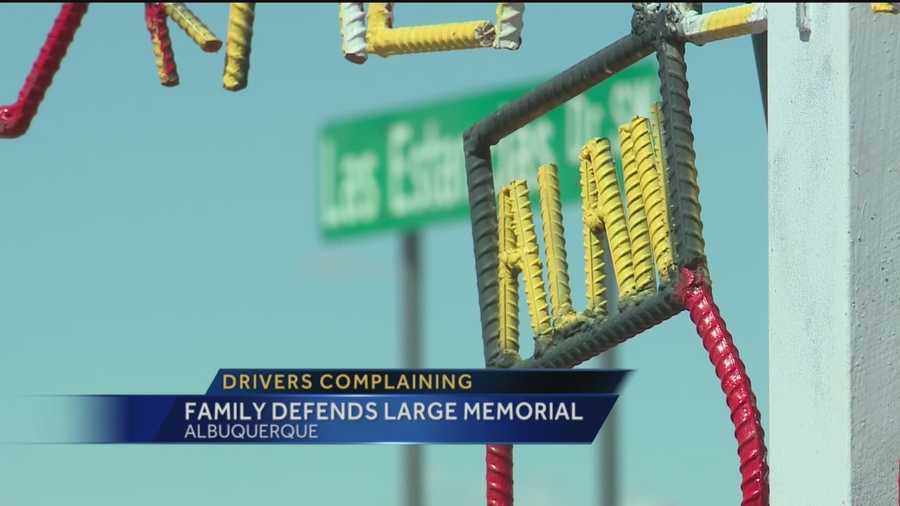 The New Mexico Department of Transportation is reviewing whether to remove a massive roadside memorial along Coors Boulevard dedicated to a popular boxer killed in a car crash.