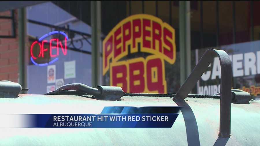 A red sticker at an Albuquerque Restaurant know for its barbeque.