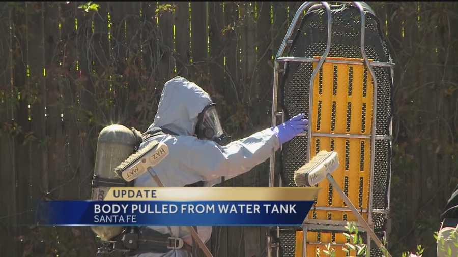 Law enforcement officials in Santa Fe have retrieved a body from a water tank behind the Lena Street lofts.