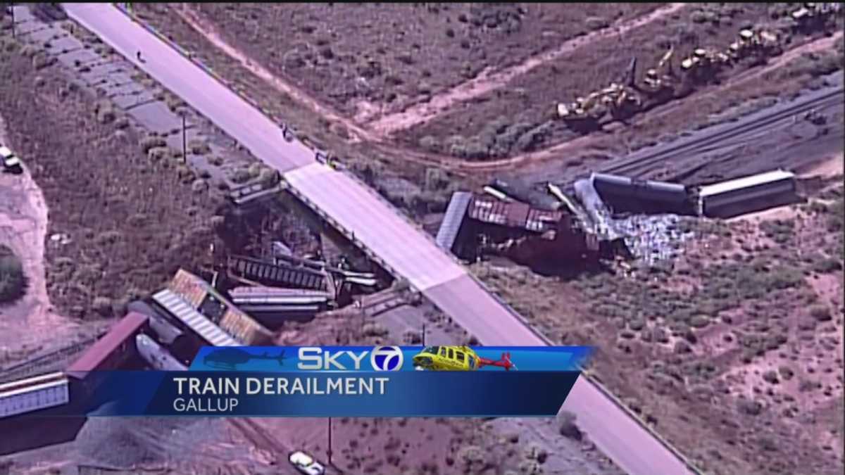 Train carrying beer, liquid asphalt derails