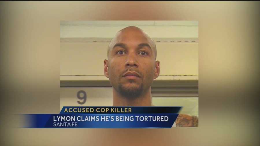 Accused cop killer claims he's being tortured