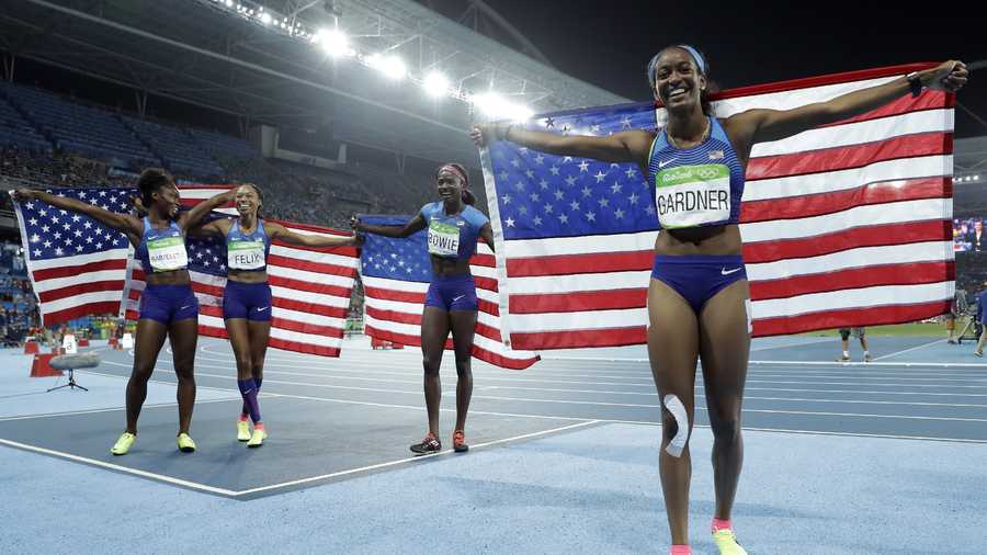 United States's Tianna Bartoletta, Allyson Felix, English Gardner and Tori Bowie celebrate winning the women's 4 x 100-meter relay final during the athletics competitions of the 2016 Summer Olympics at the Olympic stadium in Rio de Janeiro.
