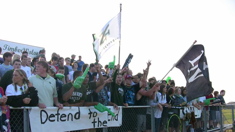 Norman North fan cheering on the boys soccer team.