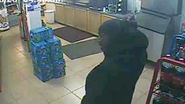 Enid police release surveillance photos from an armed robbery at the One Stop convenience story.
