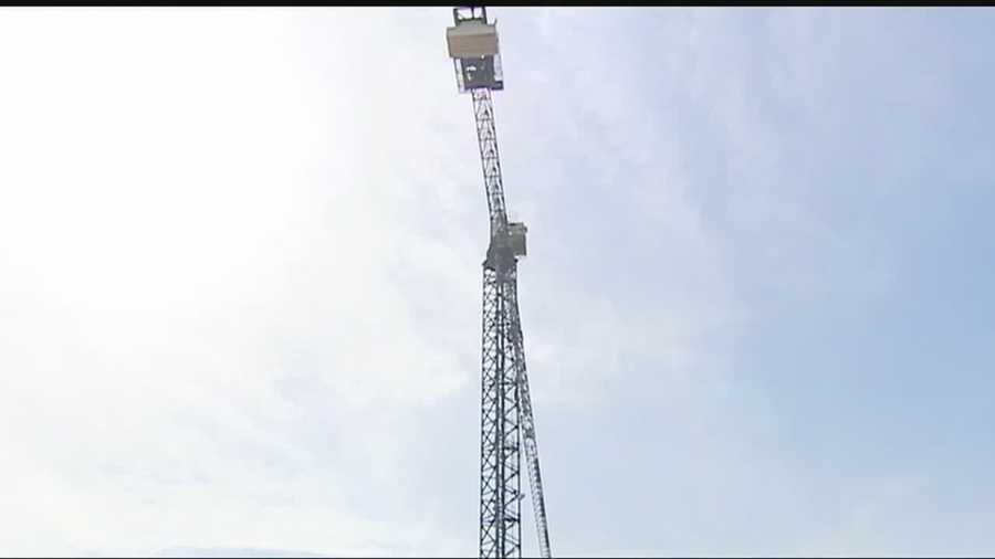 Authorities rescued a man who had a medical issue at the top of a crane that was 50 feet in the air.