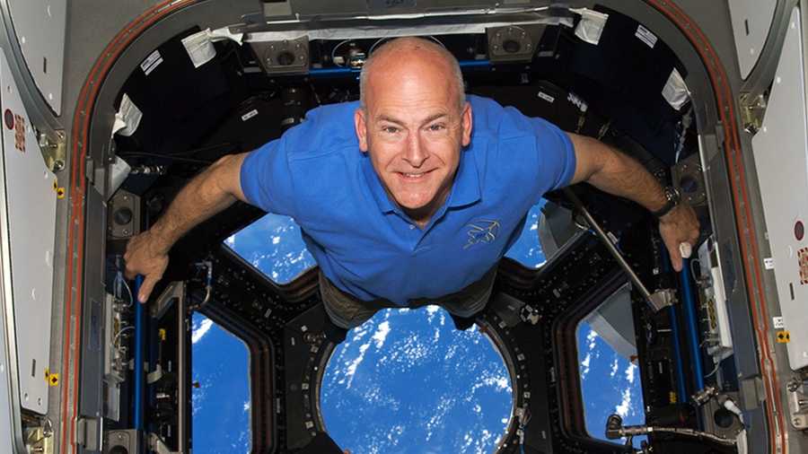 Capt. Alan "Dex" Poindexter smiles inside the Cupola onboard the International Space Station during shuttle Discovery's STS-131 mission in 2010.