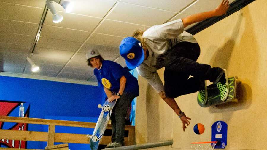 Zane Keith sinks a shot while skating in a new indoor skate park in Santa Cruz.