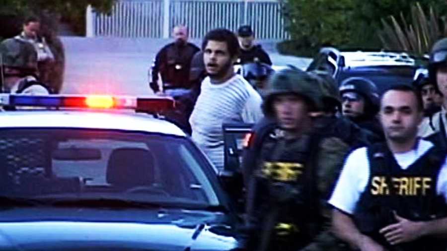 Maurice Ainsworth is seen being arrested after the 5-hour rampage in Santa Cruz on Nov. 29, 2010.
