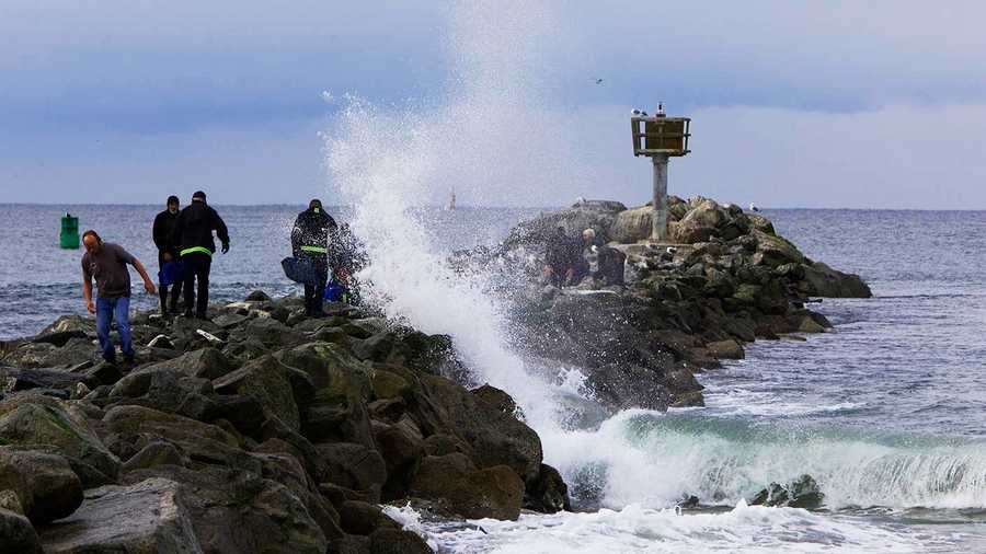 A man was found unconscious on his surfboard in Moss Landing Friday morning. 