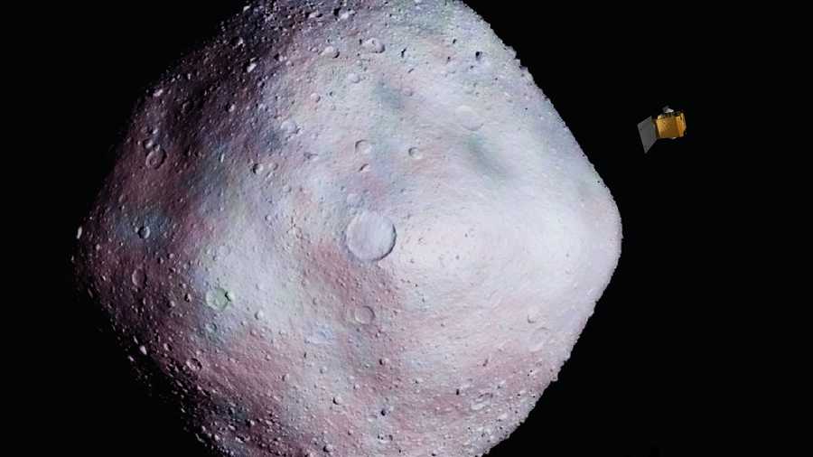 This is an artist's concept of the OSIRIS-REx spacecraft near asteroid 1999 RQ36.