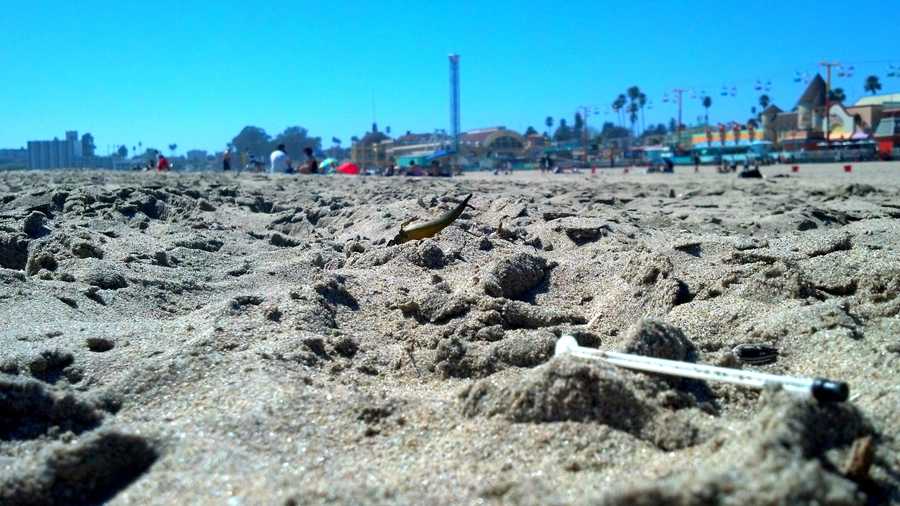 Surfer Dylan Greiner shot this photo of a needle left in the sand with the Santa Cruz Beach Boardwalk in the background.