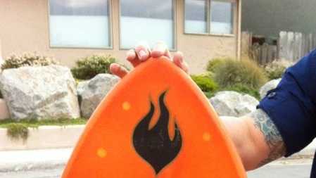 Authorities released a photo of a skin-board found washed up on the beach in Monterey Bay and are looking for a possible missing surfer.
