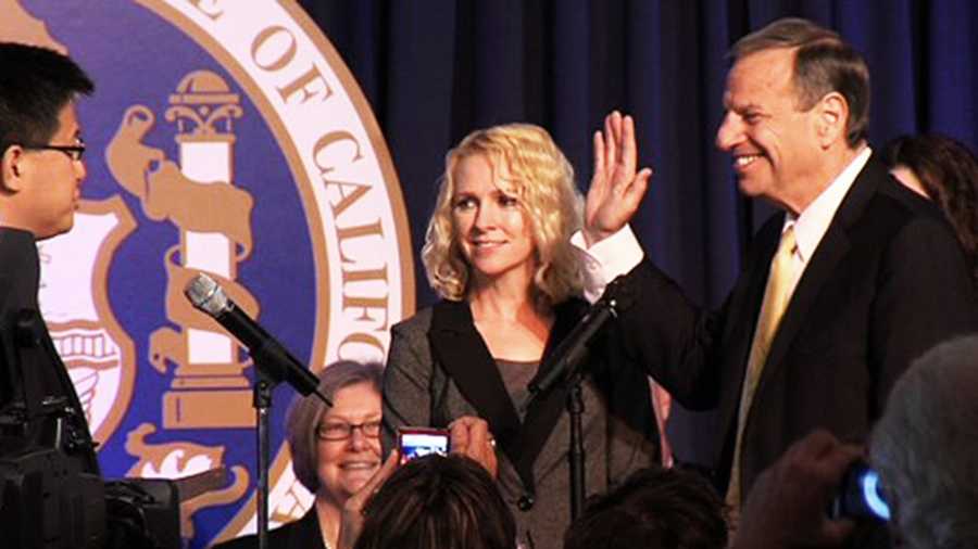 This is San Diego Mayor Bob Filner being sworn in as mayor with his then-fiance Bronwyn Ingram smiling next to him. 