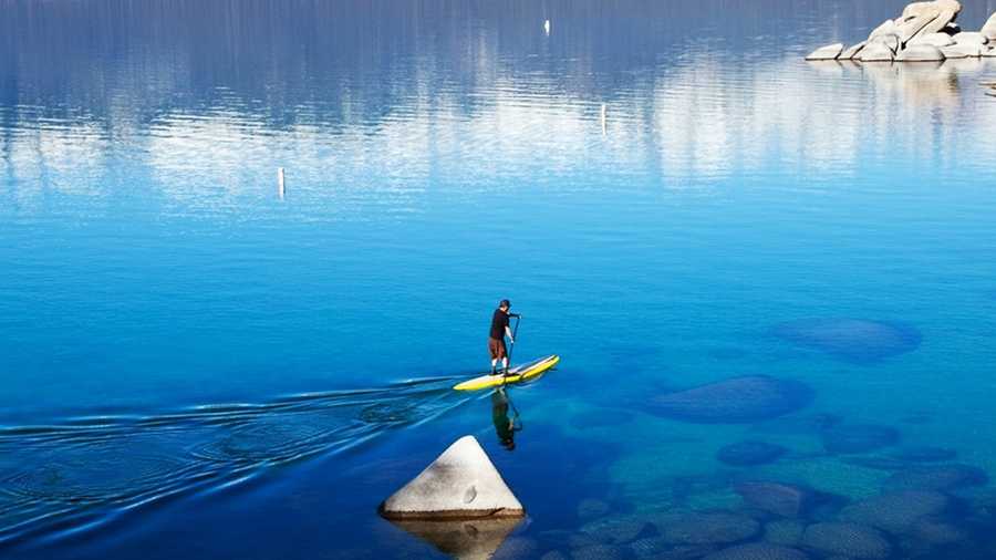 Paddle-boarding is a popular outdoor sport at Lake Tahoe. 