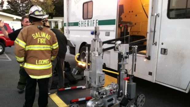 The Monterey County Sheriff's Department unloads a bomb-detecting robot at the Monterey police station on Pacific Street. (Sept. 25, 2013)