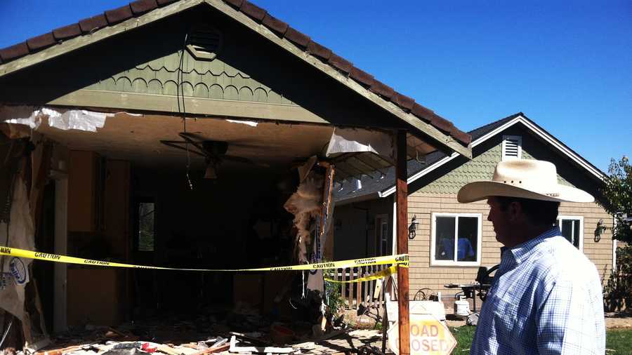 Hollister Police Chief David Westrick looks at his heavily damaged house. (Oct. 4, 2013)