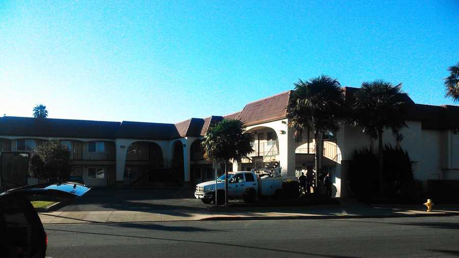Salinas police comb the Laurel Inn Motel on Dec. 5, 2013.