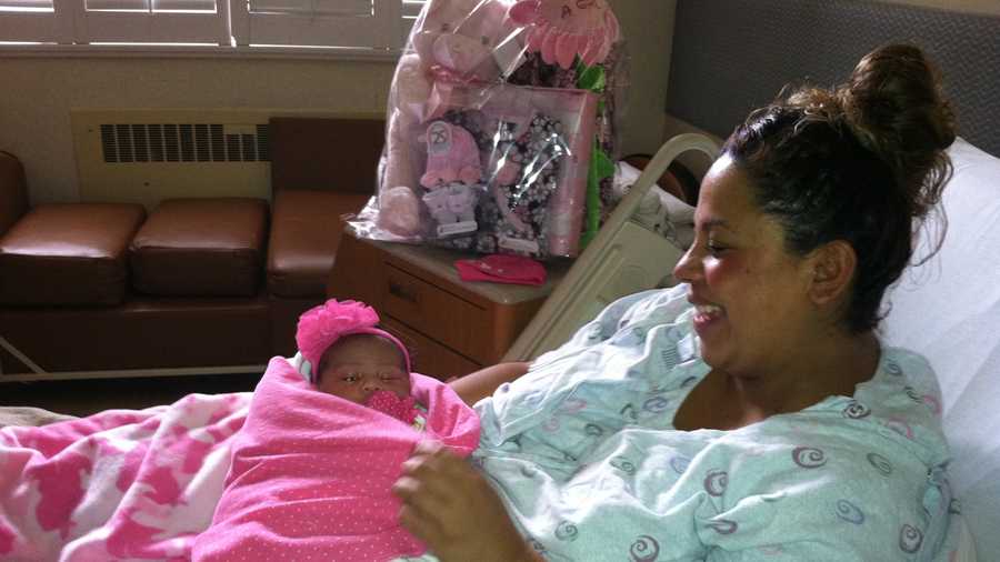 Rita Heredia holds her New Year's baby Aleena born Wednesday morning