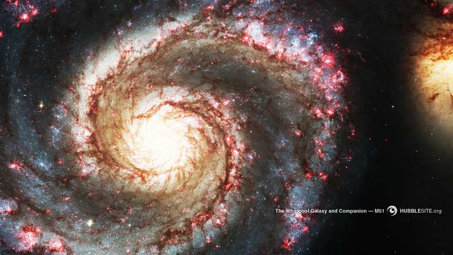 The large Whirlpool Galaxy (left) is known for its sharply defined spiral arms. Their prominence could be the result of the Whirlpool's gravitational tug-of-war with its smaller companion galaxy (right).