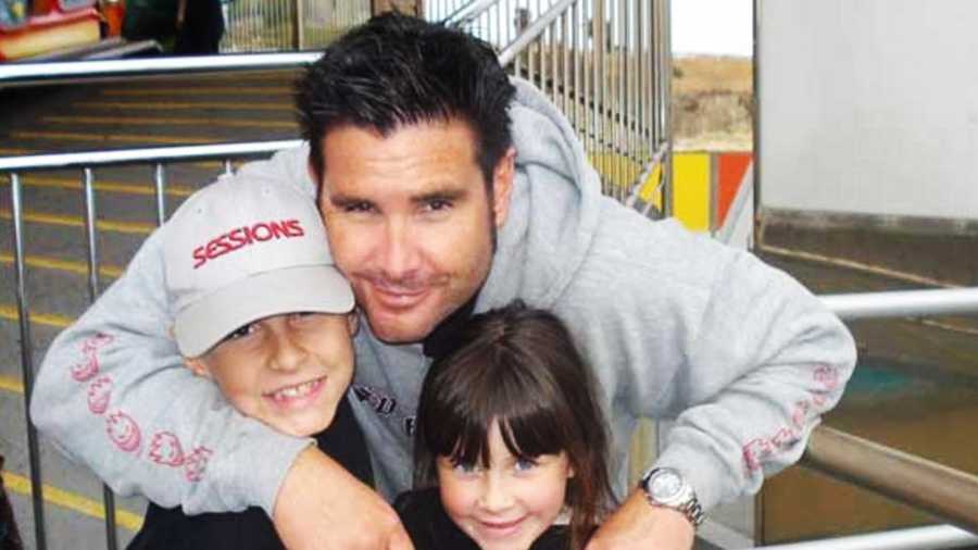 Bryan Stow smiles with his two kids. 