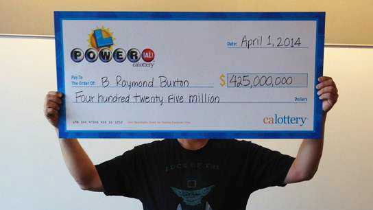 B. Raymond Buxton claims his $425 million Powerball winnings. (April 1, 2014)