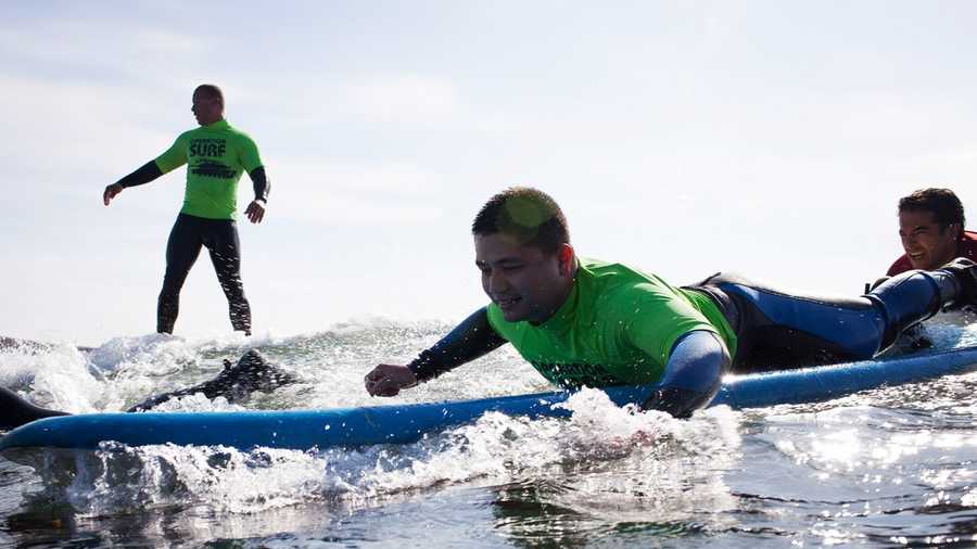 Wounded soldiers learn how to surf at Cowells Beach. (April 3, 2014)