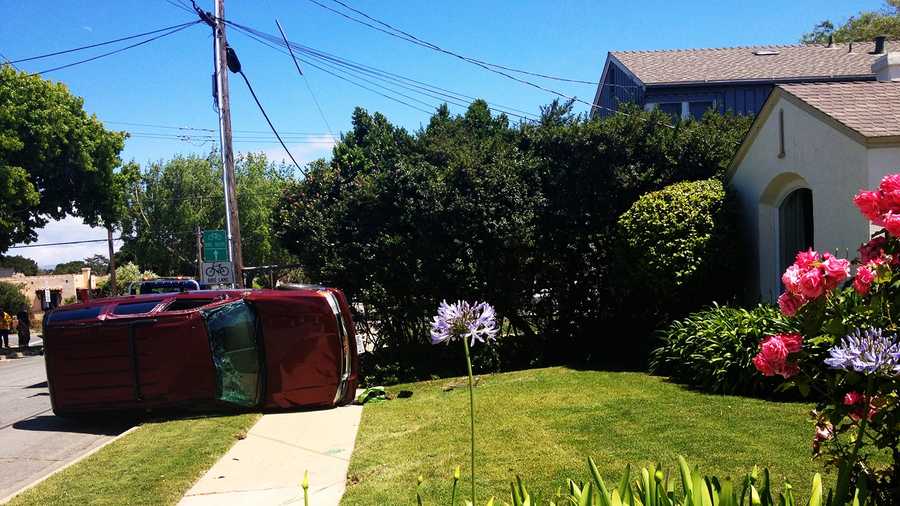An SUV landed on a house's front lawn Tuesday.  (May 6, 2014)