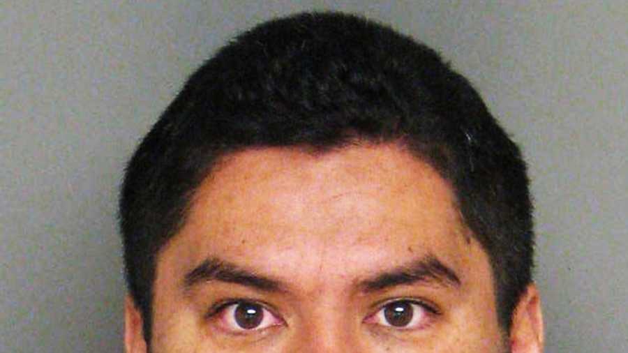 Officer Jaime Andrade is accused of possessing an assault weapon. 