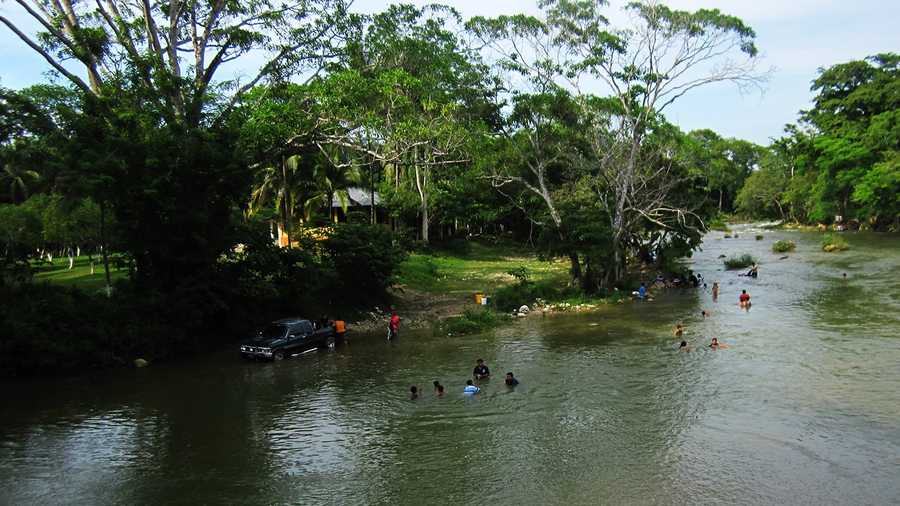 Local kids play in a river on the border of Guatemala and Belize.
