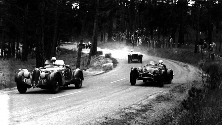 Racecar driving legend Phil Hill races an Alfa Romeo through the forests of Pebble Beach in 1951. 